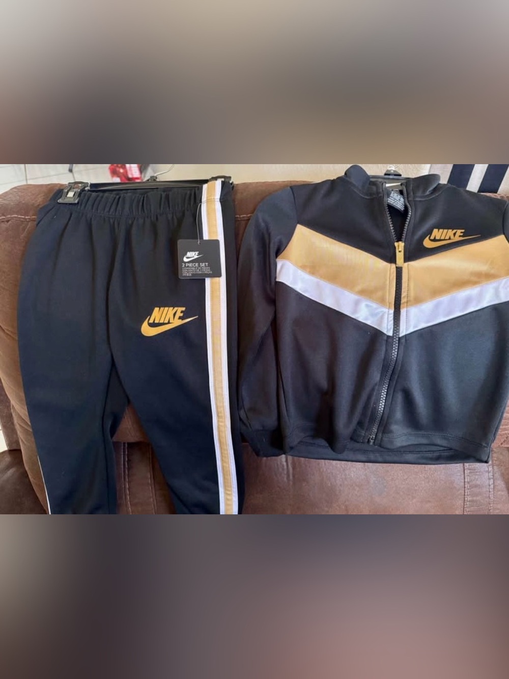 Nike Black Jacket & Track Pants with Gold and White Chevron Accents